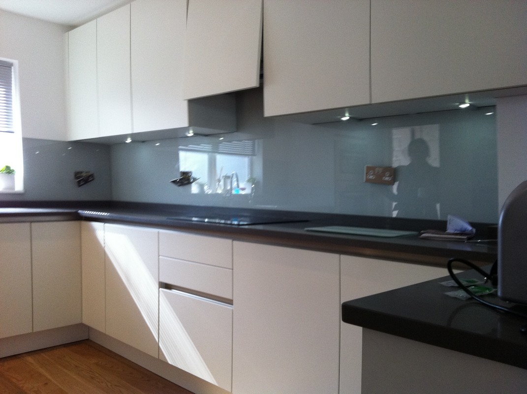 Grey glass kitchen splashback with LED lighting in Clapham