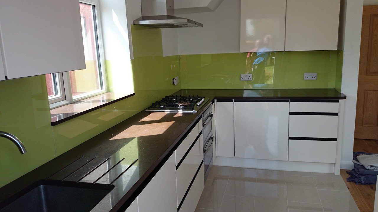 Lime green glass kitchen splashback installed by Clapham glaziers
